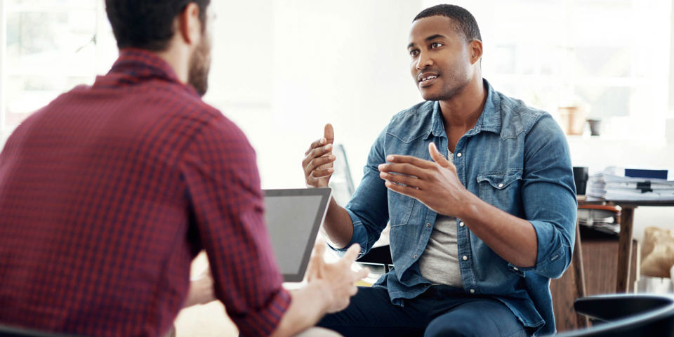 two gentlemen sitting