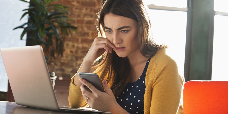 Woman sitting at work stressed