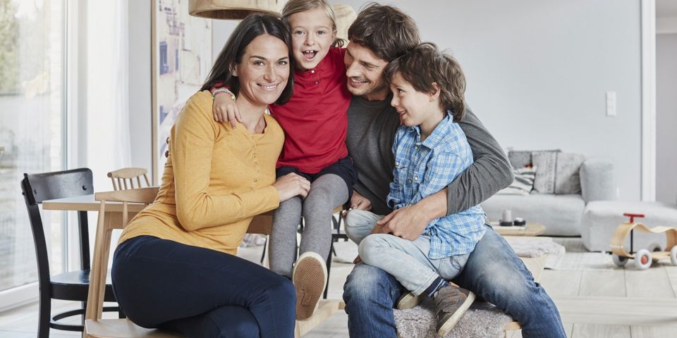 family sitting on couch