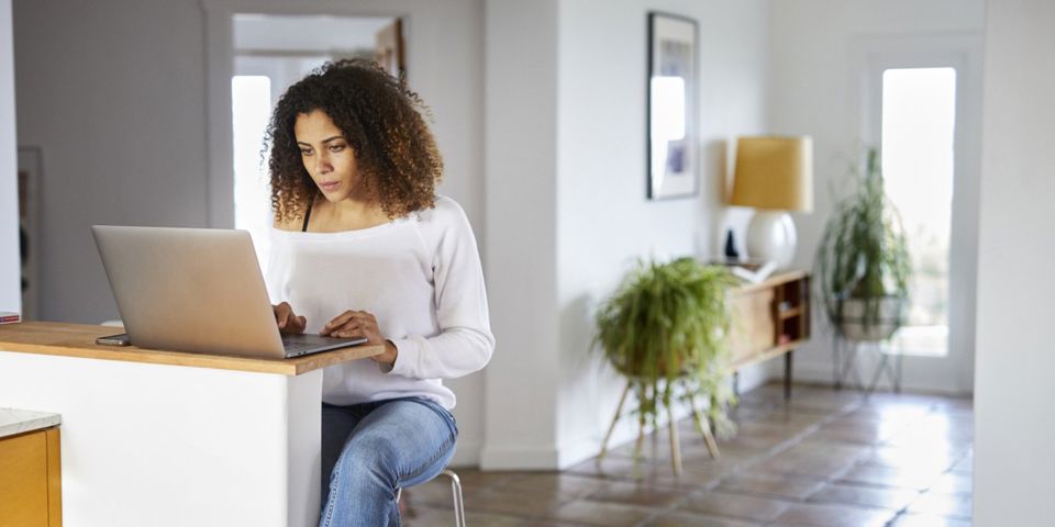 woman sitting using laptop