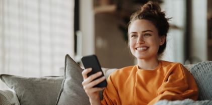  woman on couch with cellphone