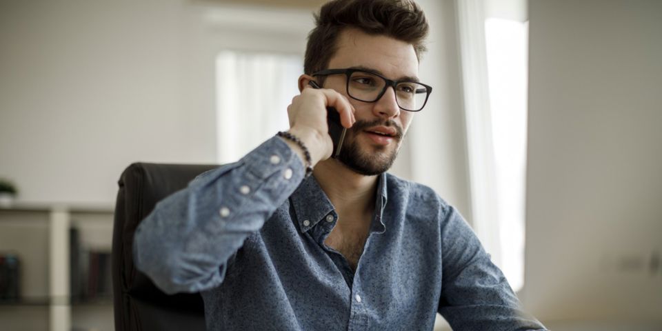 man talking on mobile device