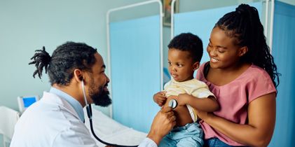 doctor with woman and child