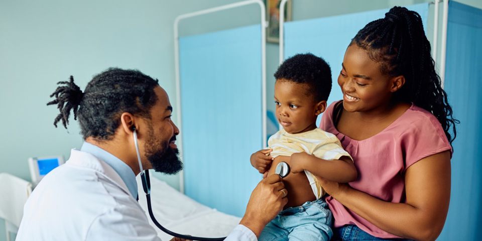 doctor with woman and child