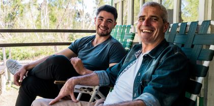 Father and son on porch