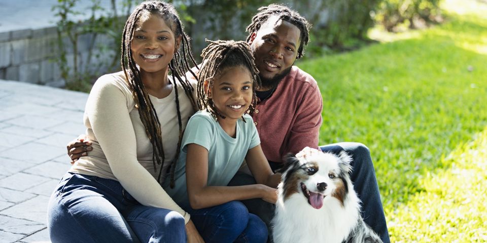family outside with dog