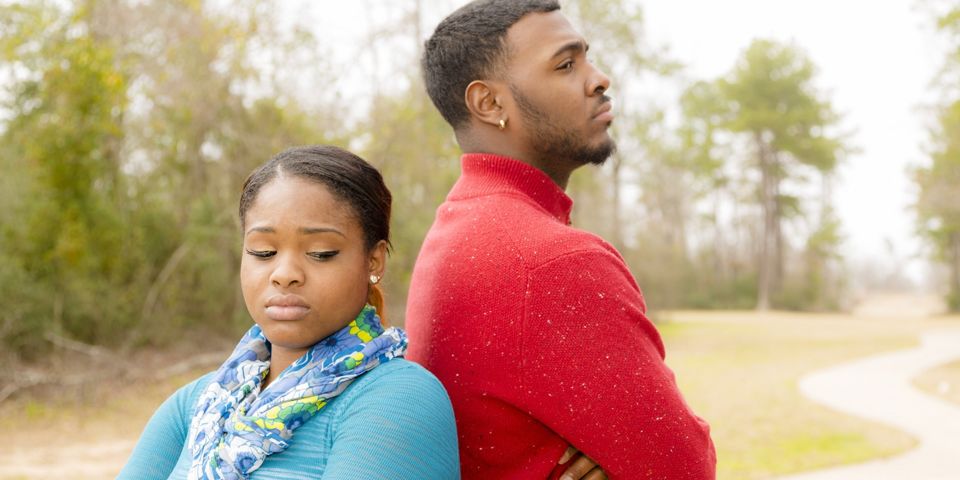 upset couple facing their backs together